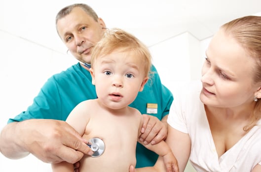 Doctor listen the babyboy with stethoscope. photo