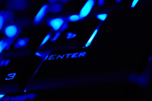 Enter key in a blue light. Macro shot. photo