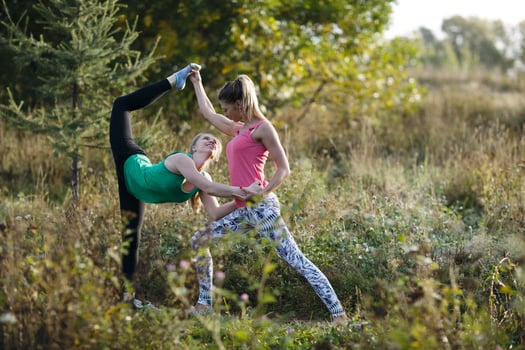Two beautiful gymnasts or dancers working out photo