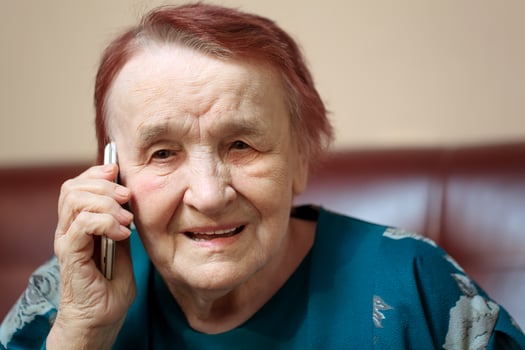 Elderly lady talking on a mobile phone photo