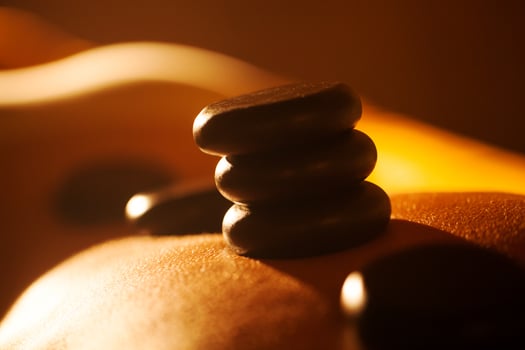 Hot stone treatment in day spa photo