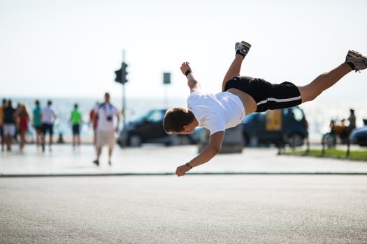 Urban acrobatics with somersault photo