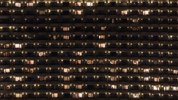Multistorey block of flats at night photo