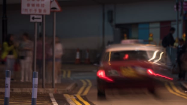 Taxi car driving along night road photo