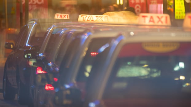 Row of taxi cars in night street photo