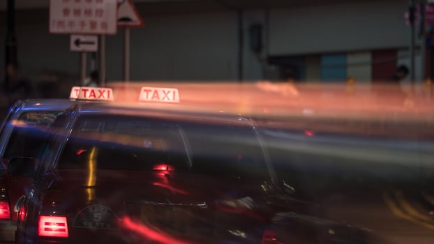 Taxi in night street of Hong Kong photo