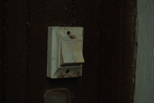 Filthy dirty old white electric light fitting photo