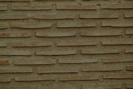 Old brick wall background texture with long bricks photo