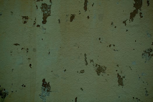 Grunge off white stained wall with flaky paint photo