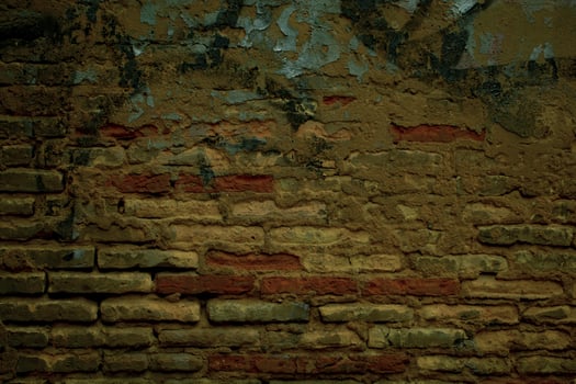 Old grunge weathered brick wall with graffiti photo