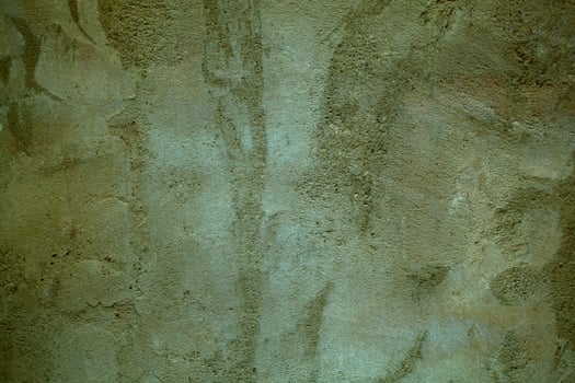 Grungy dark green wall with faded paint photo