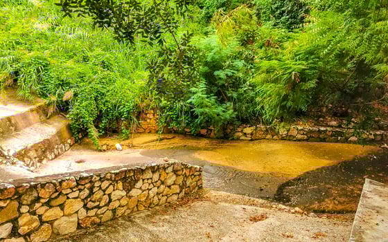 Open sewerage system in the tropical jungle mountains Mexico. photo