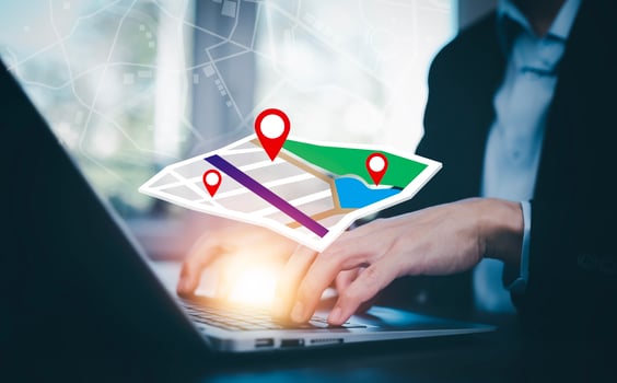 Man using Smartphone with virtual world and model map with location point, GPS app, icon Travel maps and find places in the online system, all screen graphics are generated, Searching for travel. photo