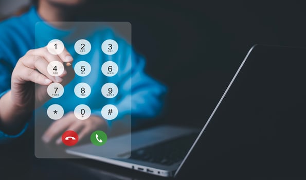 Dialing on virtual telephone keypad with transparent telephone buttons, businessman touch button of telephone number on screen, Finger touch number on smartphone to make a call, close up photo