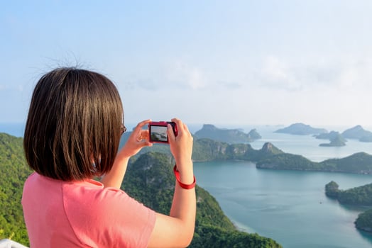 Woman on peak take photos