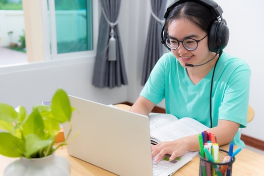 Asian young woman student use laptop keyboard photo