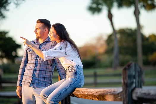 Happy couple in the park on summer day outdoors photo