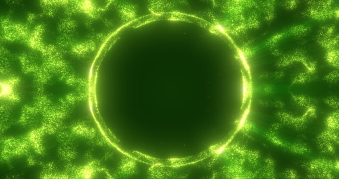 Abstract green background from an energy blue magic ring of a round frame of glowing particles and waves of energy photo