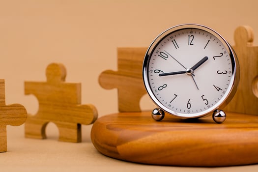 Clock and jigsaw puzzle pieces. Time lapse time. Wooden jigsaw puzzle pieces. communication teamwork key components photo