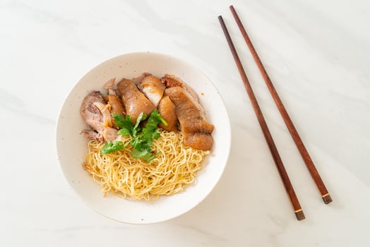 dried stewed pork leg noodles bowl photo