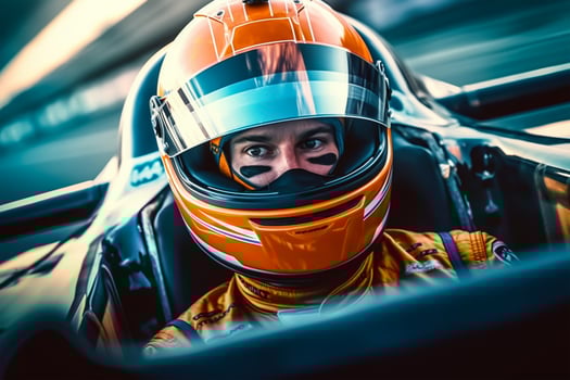 Close-up portrait of a young man driving a fast car on the race track. photo