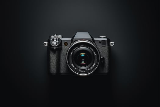 Black camera on black background photo