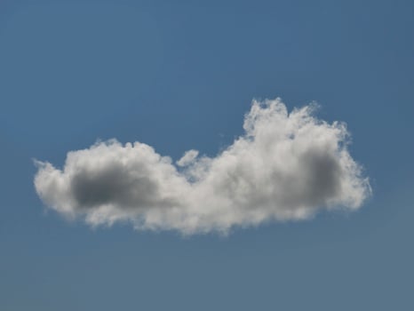 Single white cloud over blue sky background. Fluffy cumulus cloud shape photo