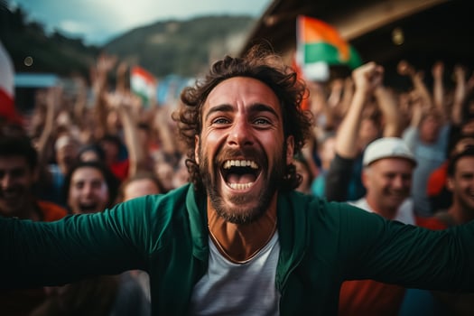 Italian beach soccer fans celebrating a victory photo