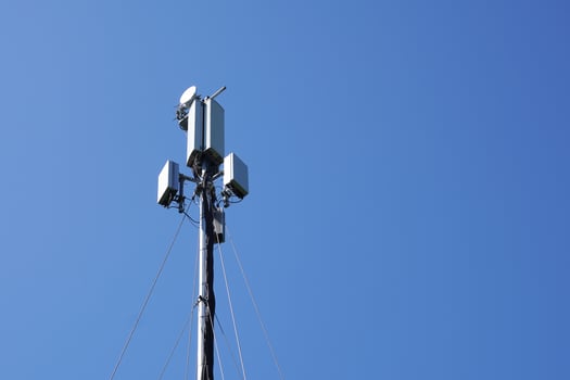mobile cell tower against blue sky photo