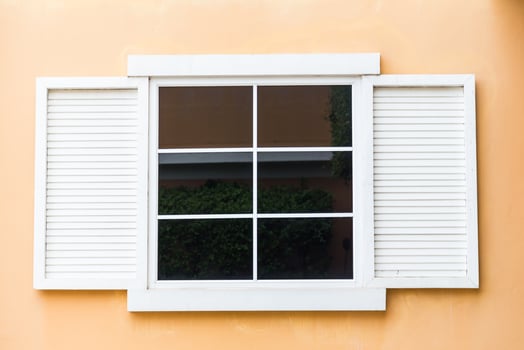 Vintage window on yellow cement photo