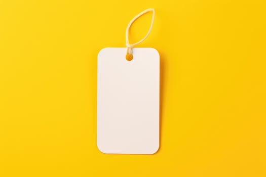 A mock-up of a white empty tag with a rope on a yellow background. AI generated photo