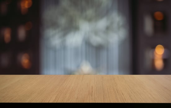 Empty wooden table in front of abstract blurred background of coffee shop . can be used for display or montage your products.Mock up for display of product photo