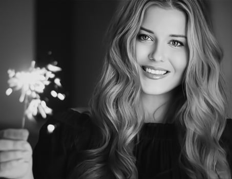 Holiday magic, Christmas and New Year celebration, happy woman with sparklers photo