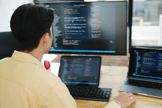IT Programmer Starts Working on Desktop Computer. photo