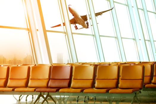 passenger plane flying outside airport terminal building photo
