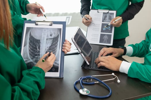 The doctor joins a meeting with the surgeon's team to discuss a plan for cancer surgery after the medical team detects cancer. Collaborative concept of a team doctors and surgeons in surgery. photo