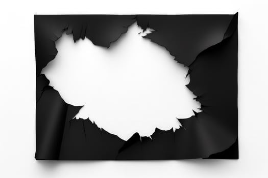 Black paper ripped message torn isolated on white background photo