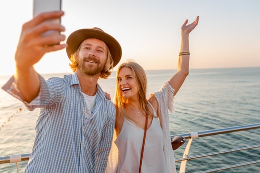 attractive happy couple traveling in summer on bicycles photo