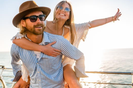 woman and man in love traveling sunset sea photo