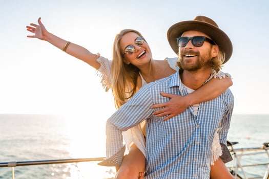 woman and man in love traveling sunset sea photo