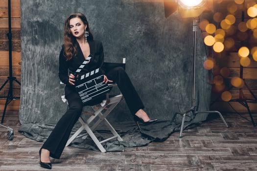 young beautiful stylish sexy woman on cinema backstage photo