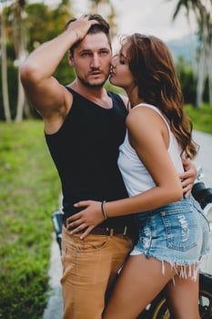 young couple in love, riding a motorcycle, hug, passion, free spirit photo