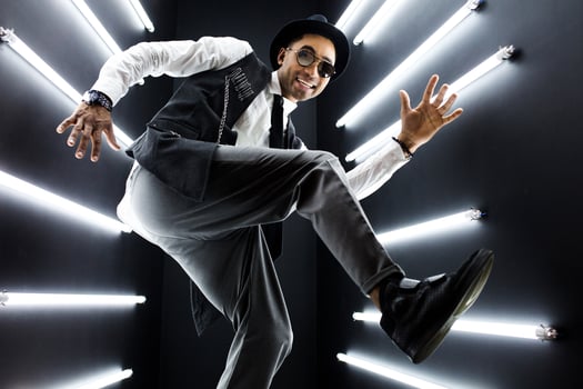 black man dancing in neon lights photo