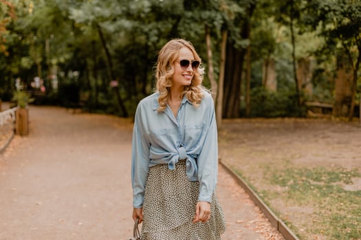 attractive woman walking in street photo