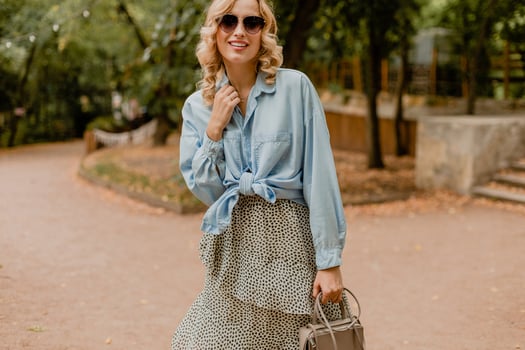 attractive woman walking in street photo