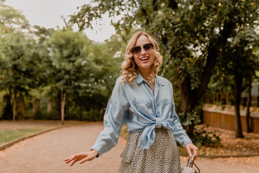 attractive woman walking in street photo
