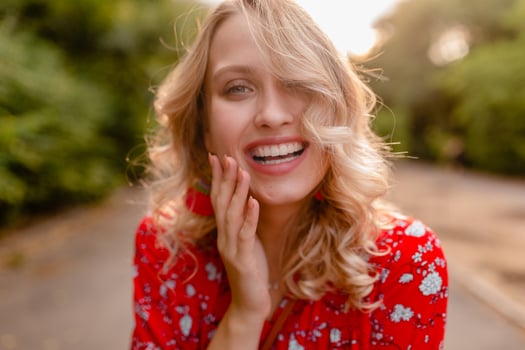 attractive stylish blond smiling woman in straw red blouse summer fashion photo