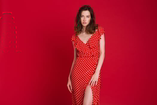 stylish woman in summer fashion trend dress on red background photo
