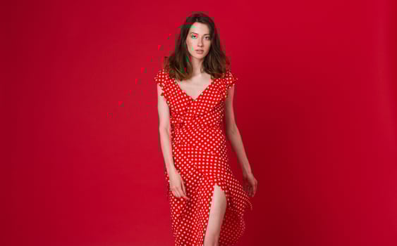 stylish woman in summer fashion trend dress on red background photo