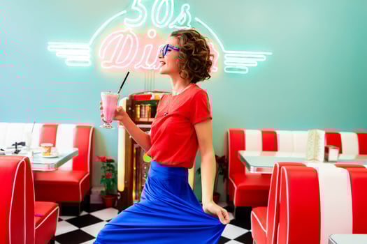 stylish smiling woman in retro vintage cafe photo